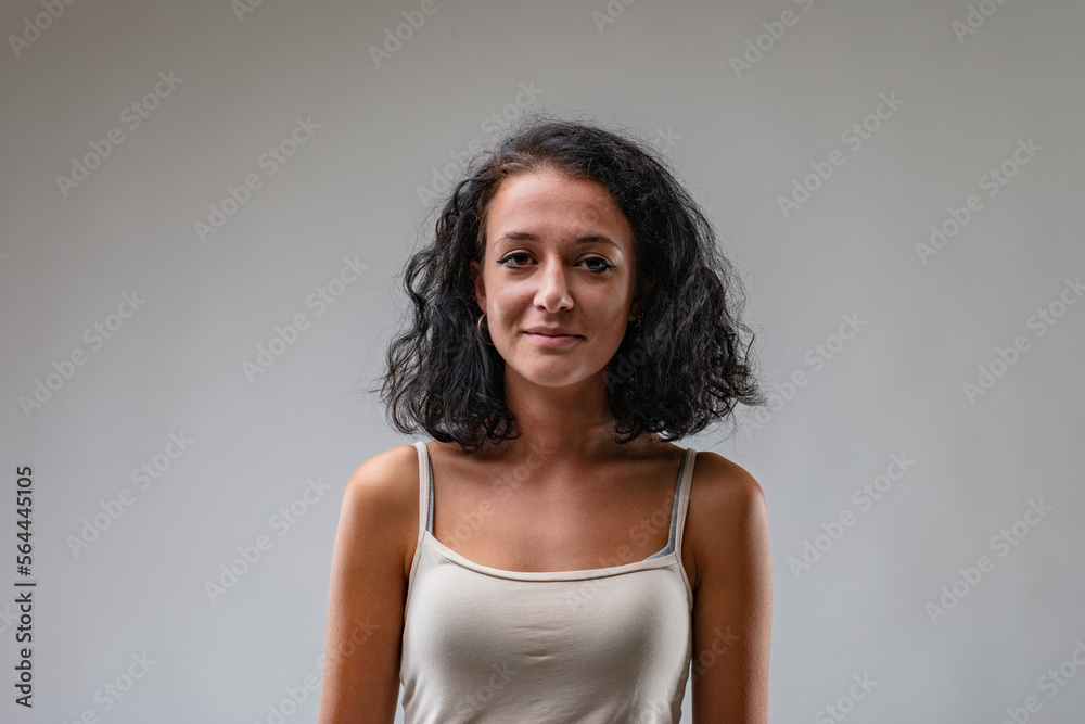 Calm, tanned girl in tank top Calm, tanned girl in tank top