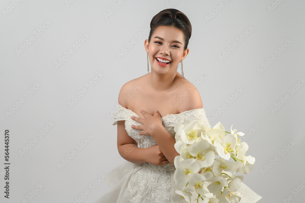 Young asian beautiful bride smiling with happy on white background Young asian beautiful bride smiling with happy on white background