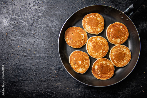 Homemade pancakes in a frying pan. 