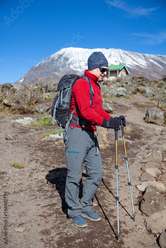 Male backpacker on the trek to Kilimanjaro mountain.
