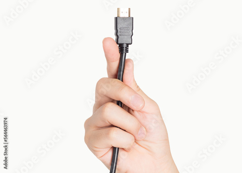 closeup hand holding computer HDMI cable plug