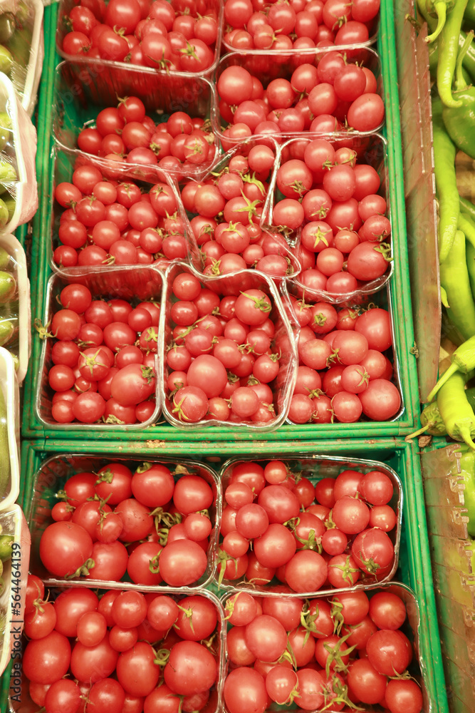 red color small tomato on table red color small tomato on table