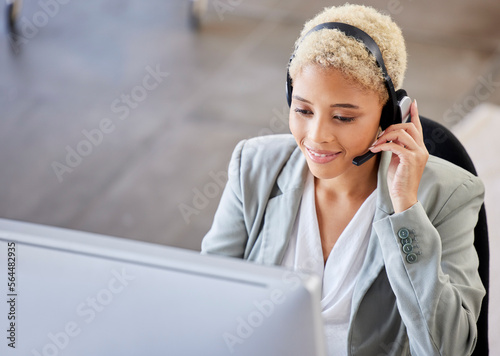 Top view, call center and black woman in office, customer support for telemarketing, help or consulting. African American female agent, lady or consultant with headset, advice or talking in workplace