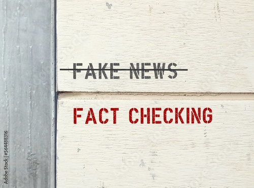 Bild auf Leinwand Text on wall FAKE NEWS (cross out) FACT CHECKING ,concept of protection from mad