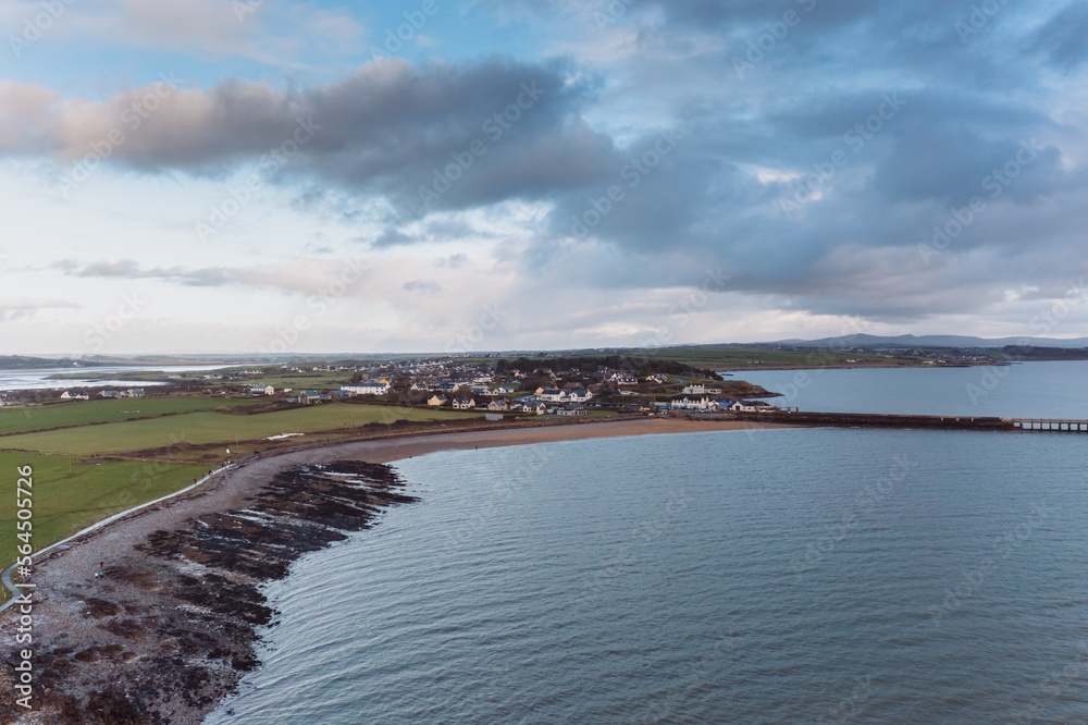 Aerial panorama view of the Samphire Island in Tralee Bay, dramatic sky, beautiful clouds, sunset. High quality photo