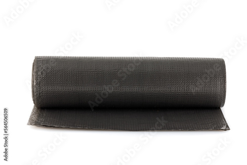 Roll of black plastic garbage bags isolated on white background. Full depth of field. Close-up