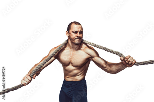 Strong bodybuilder holds rope hanging on neck and shoulders while isolated on white background
