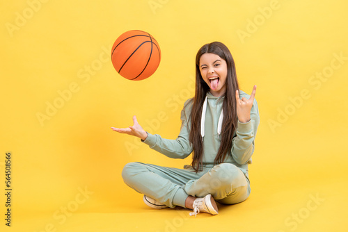 cool teen basketball girl in studio. teen basketball girl on background. © be free