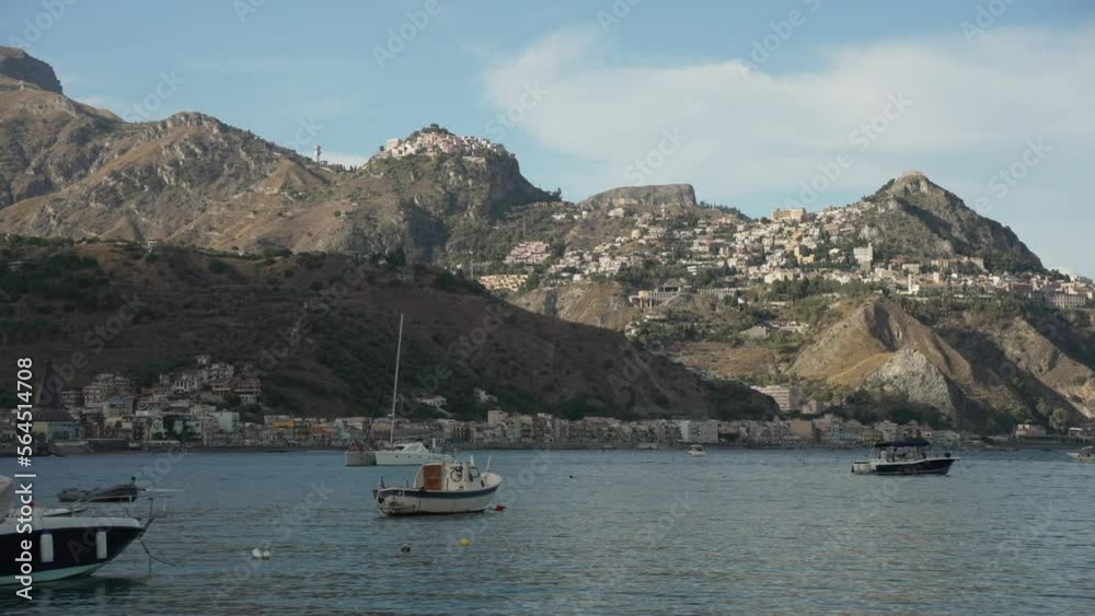 Boats in Bay of Naxos with Castelmola and Taormina in the background, Messina, Sicily Boats in Bay of Naxos with Castelmola and Taormina in the background, Messina, Sicily