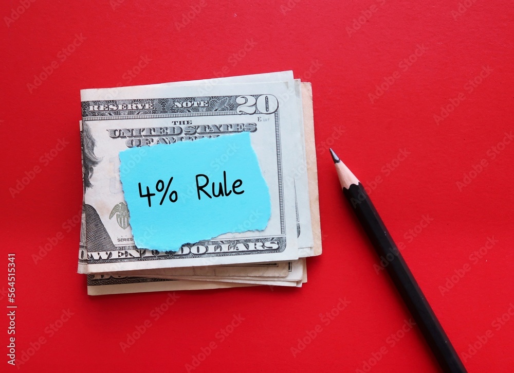 cash dollar money on red copy space background with handwritten note 4% RULE, rule of thumb states that withdrawing and spending 4% of total fund, to make retirement savings last longer cash dollar money on red copy space background with handwritten note 4% RULE, rule of thumb states that withdrawing and spending 4% of total fund, to make retirement savings last longer