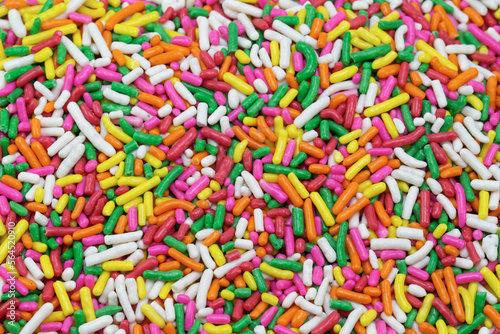 colorful sugar sprinkles, decoration for cake and bakery as background