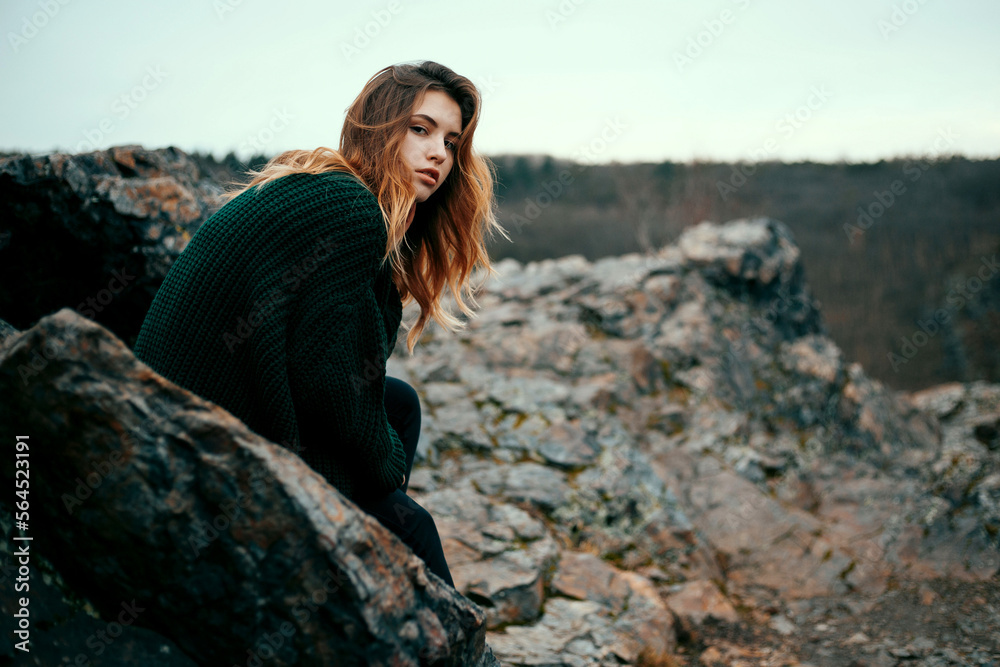Naklejka premium Fashionable young girl with messy hair in sweater outdoor