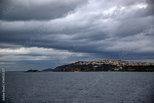 Procida Island on a rainy day with dramatic clouds © erika8213
