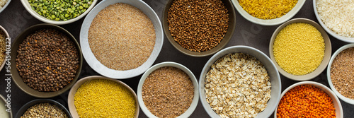 Various grain cereals in bowls banner, top view