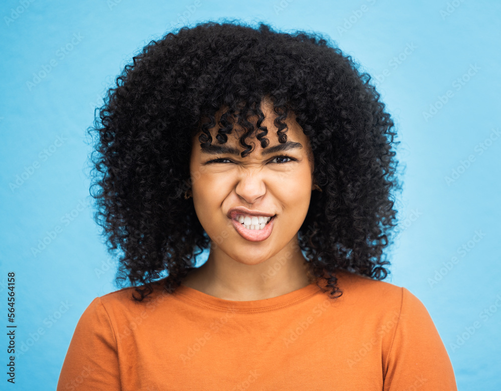 Portrait, emoji and woman with facial expression in studio for fun, relax and playful attitude on blue background. Face, comic and goofy black woman with a funny face, crazy and personality isolated Portrait, emoji and woman with facial expression in studio for fun, relax and playful attitude on blue background. Face, comic and goofy black woman with a funny face, crazy and personality isolated