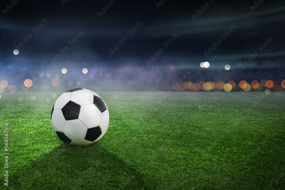 Soccer ball lies on stadium grass in the smoke with copy space, 3D Illustration