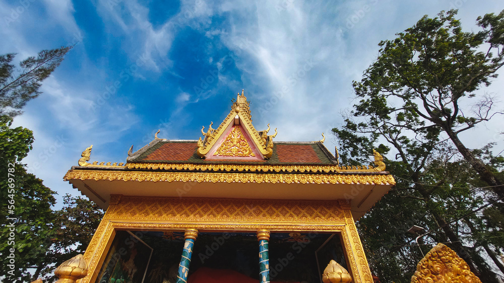 Fototapeta premium Low angle view of Wat Traeuy Kaoh Buddhist temple on Fish Island in Kampot, Cambodia