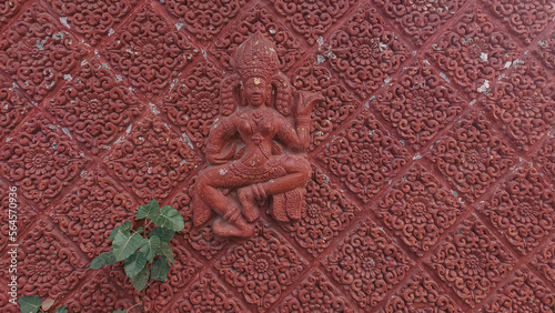Elaborate wall sculpture of an Apsara dancer female celestial spirits in Hindu and Buddhist mythology in Cambodia and other parts of Southeast Asia