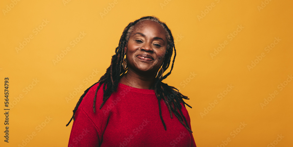 Portrait of a woman with dreadlocks smiling at the camera Portrait of a woman with dreadlocks smiling at the camera