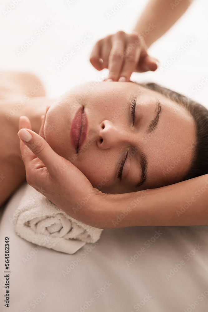 Masseuse doing massage to client Masseuse doing massage to client