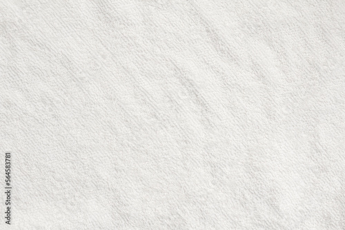 Close-up of white pile fabric with fine irregularities seen from overhead angle