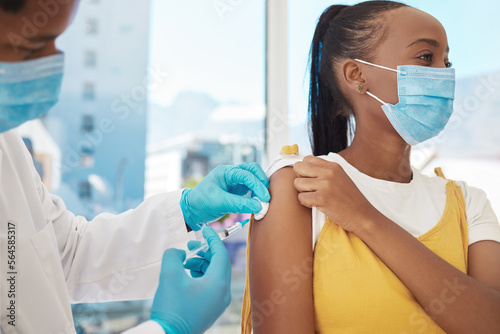 Vaccine  doctor and patient with health  Corona and hospital  black people with healthcare and injection. Medicine for safety against virus  needle syringe and man with woman in mask for Covid