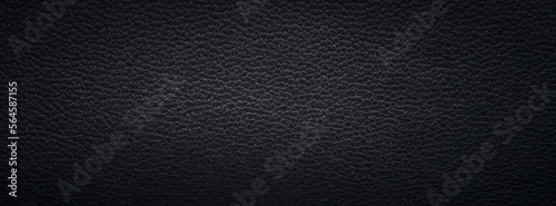 Texture of a fine black leather surface using as background or header