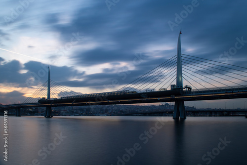 Long exposure. View of Haliç Metro Bridge connecting Azapkapı (Beyoğlu) and Unkapanı (Fatih) (Halic Metro Bridge). blue sky Istanbul Turkey 