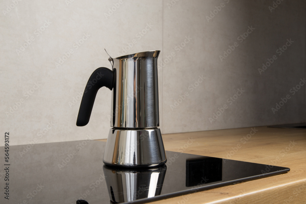 a geyser coffee machine brews at home on an induction stove a geyser coffee machine brews at home on an induction stove