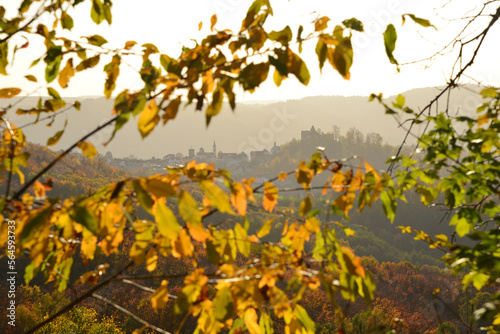 Herbstliche Landschaft von der Schönen Aussicht südlich von Lindenfels im Odenwald mit Blick auf Lindenfels im Gegenlicht Richtung Weschnitztal, Hessen photo