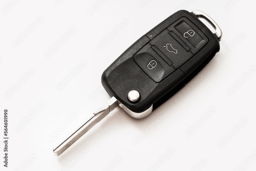 A macro photo of a black car key on a white background A macro photo of a black car key on a white background
