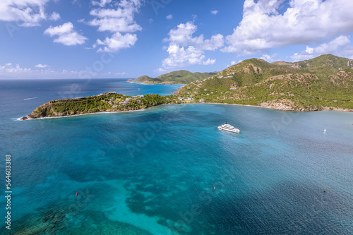 The drone aerial view of Deep Bay beach in Antigua Island.