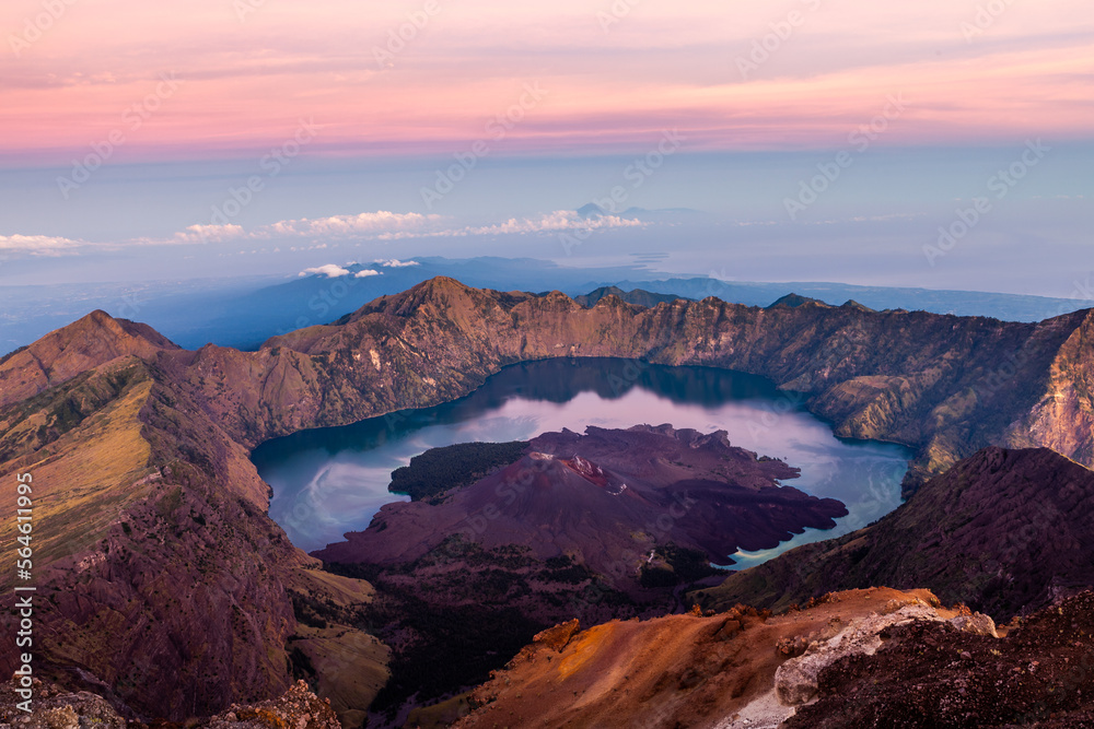 Mount Rinjani. View from the top of the mountain at sunrise. Beatuiful landscape of volcano caldera at Lombok island, Indonesia.