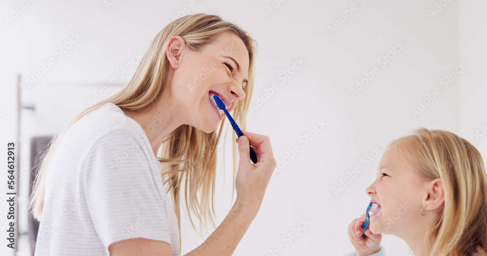 Toothbrush, mother and girl cleaning their teeth in the morning in the bathroom of their family home. Happy, bond and mom doing a dental hygiene routine for health with oral products with her child. Toothbrush, mother and girl cleaning their teeth in the morning in the bathroom of their family home. Happy, bond and mom doing a dental hygiene routine for health with oral products with her child.