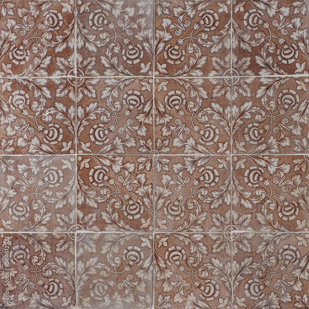 Faded, not corrected, vintage azulejos, glazed ceramic tiles with ornaments on building wall. Heritage Concept of traditional Portuguese art.