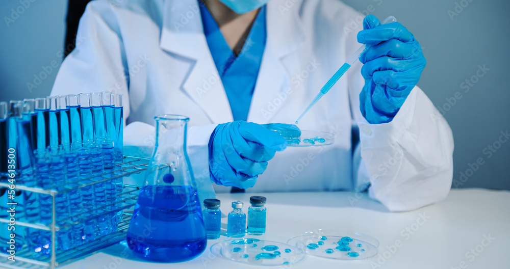 Asian young student scientist researching and new chemical substances in a laboratory. Asian young student scientist researching and new chemical substances in a laboratory.