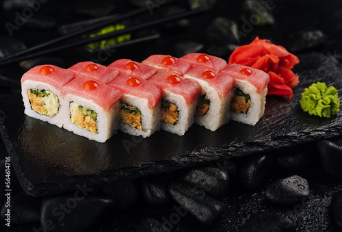 Japaneese food, tuna sushi rolls on stone board photo