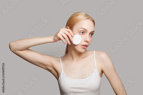 Perfect woman with cotton pad. Facial treatment, cosmetology, skin care concept