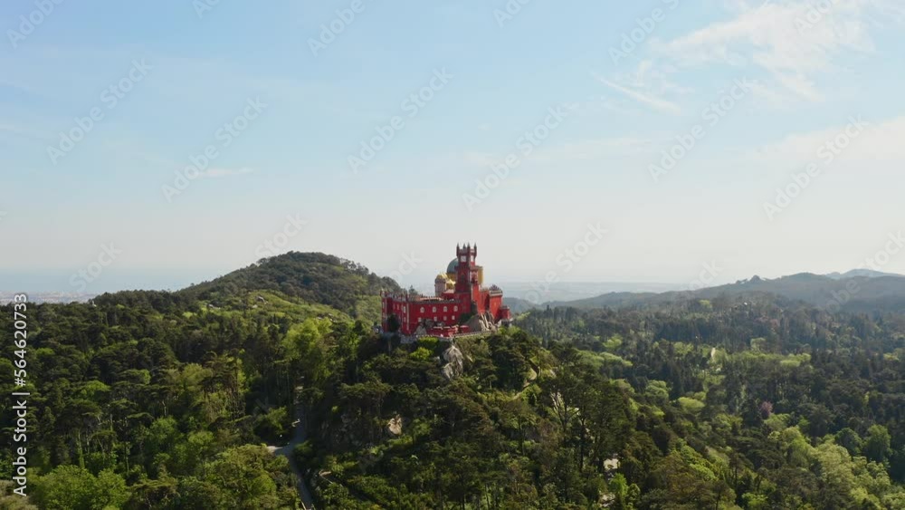 Drone footage Portugal Europe country touristic palace Pena old castle historic mansion residence in Sintra region with hilly mountains natural green park panoramic sightseeing aerial view travel trip