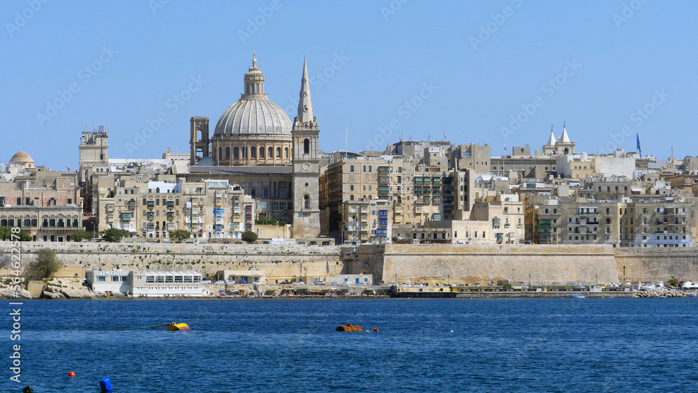 the beautiful cupola of St John's Cathedral and the city of Valletta, the capital of Malta.  Seen from Sliema