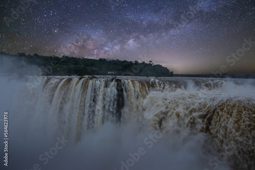 Stunning Night View of Iguacu Waterfalls in Brazil with Stars and Milky Way. Beautiful Natural Scenery in South America