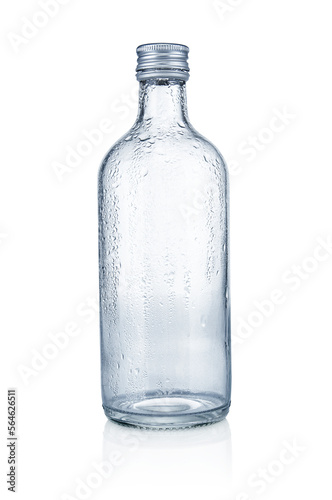 Empty glass bottle with water drops on white background