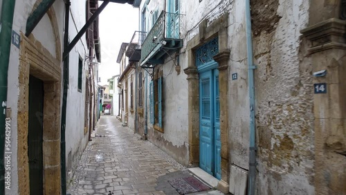 Steadicam shot walking through narrow pedestrian street in residential neighborhood in North Nicosia, in the (largely unrecognized) Turkish Republic of Northern Cyprus
