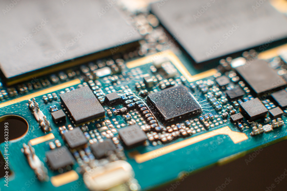 Smartphone PCB and chips super close-up - very small SMD elements Smartphone PCB and chips super close-up - very small SMD elements