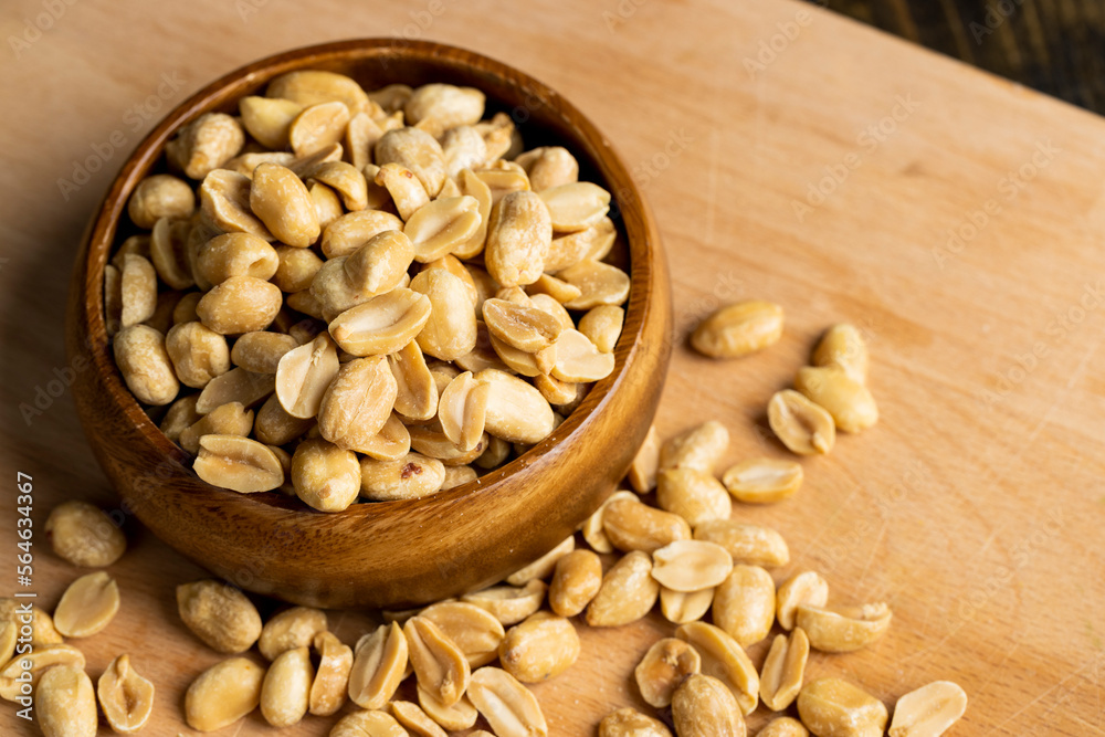 Peeled and roasted peanuts on the table