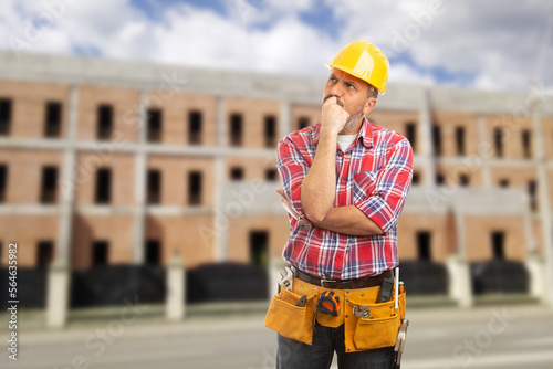 Worker making thinking gesture with hands