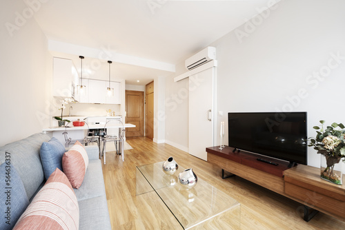 Tableau sur toile Living room of a short term rental apartment with contemporary decor with oak fl