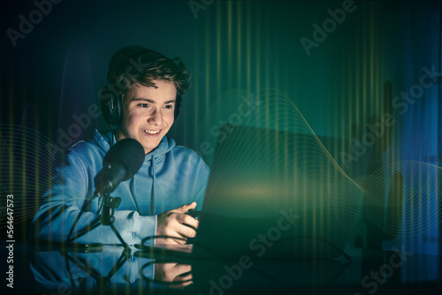 Young boy with headphones play online and chat with friends. Sound waves on foreground Gamer concept