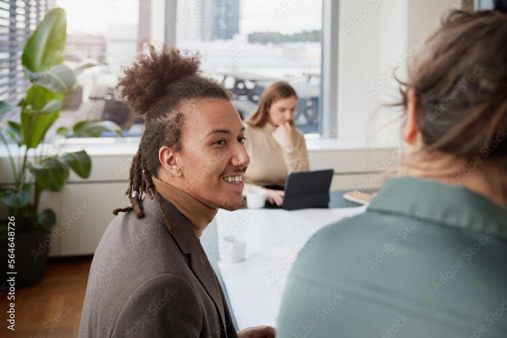 Smiling man in office Smiling man in office
