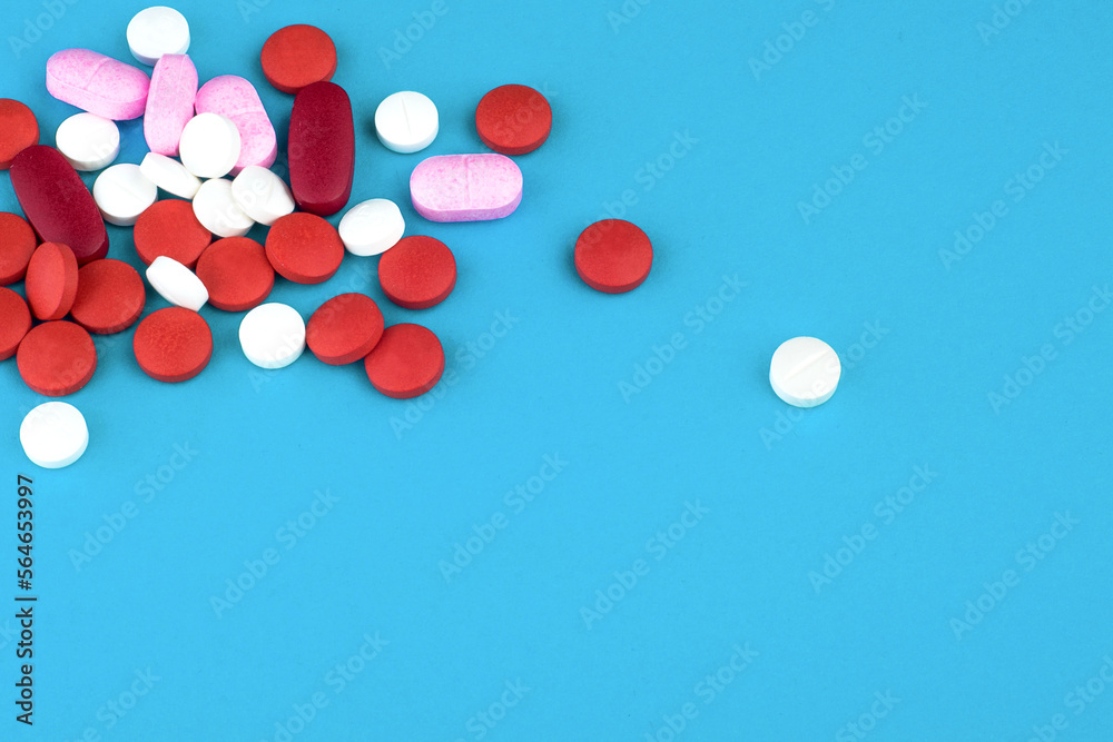 Pills red, pink, white with blue background